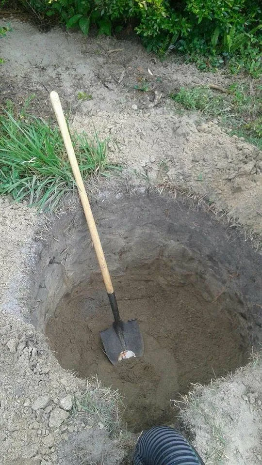 Hand dug round drywell pit shovel black corrugated pipe, Lake Mary